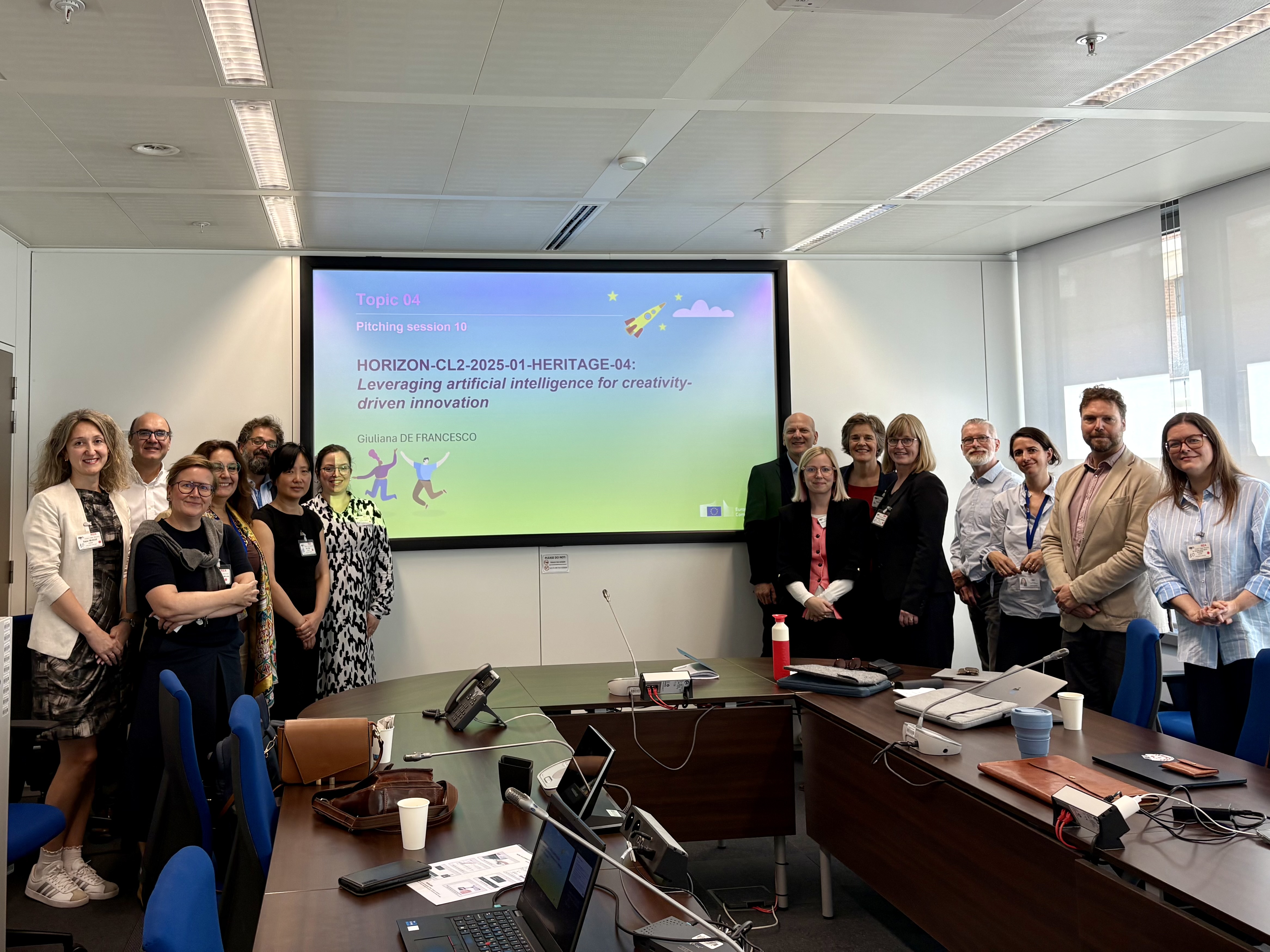 Coordinators of the EU projects in the same pitching session as CULTURAI standing in front of a PowerPoint slide with the call topic